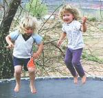 Arianne and her cousin Aubri Anne having a good bounce in St. George