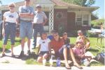 Enthralled at the Provo 4th of July Freedom Festival Parade. Note adults making shade for kids -- it was about 100 degrees that morning!