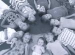 10 of the 13 grandkids forming a sort of sundial or wagon wheel or manhole cover or  . . whatever. Photo courtesy of Nate Morley