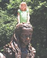 Ari in Central Park on the Alice in Wonderland statue