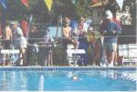 Ari winning a backstroke race with Coach Mom and Harrison cheering her on