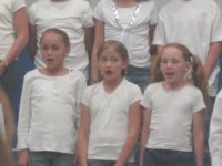 Arianne (center) performing with her school choir