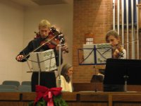 Harrison performing on viola at annual Creche exhibit