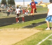 Harrison on a longjump takeoff